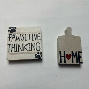 Two small hand crafted painted decorative signs.